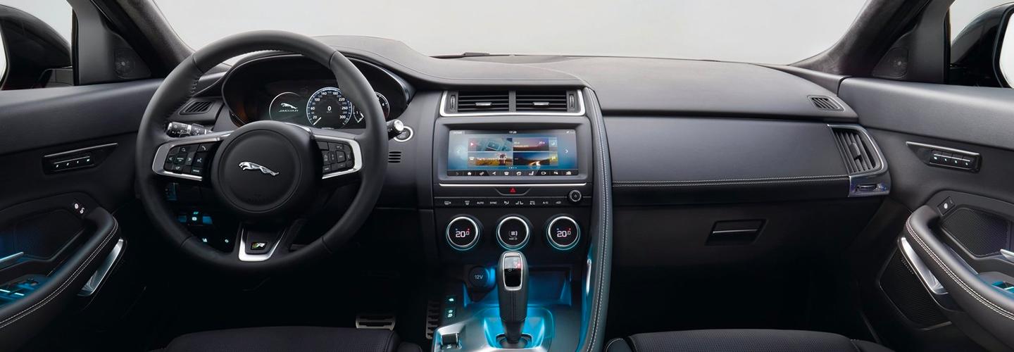 Interior steering wheel and infotainment view of the 2020 Jaguar