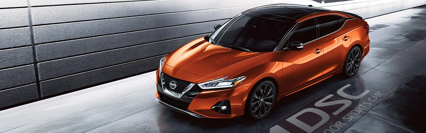 Orange 2020 Nissan Maxima parked