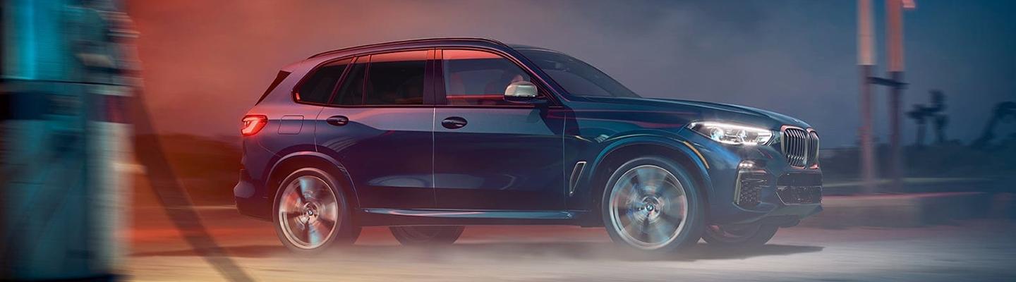 Side view of the 2021 BMW X5 in motion