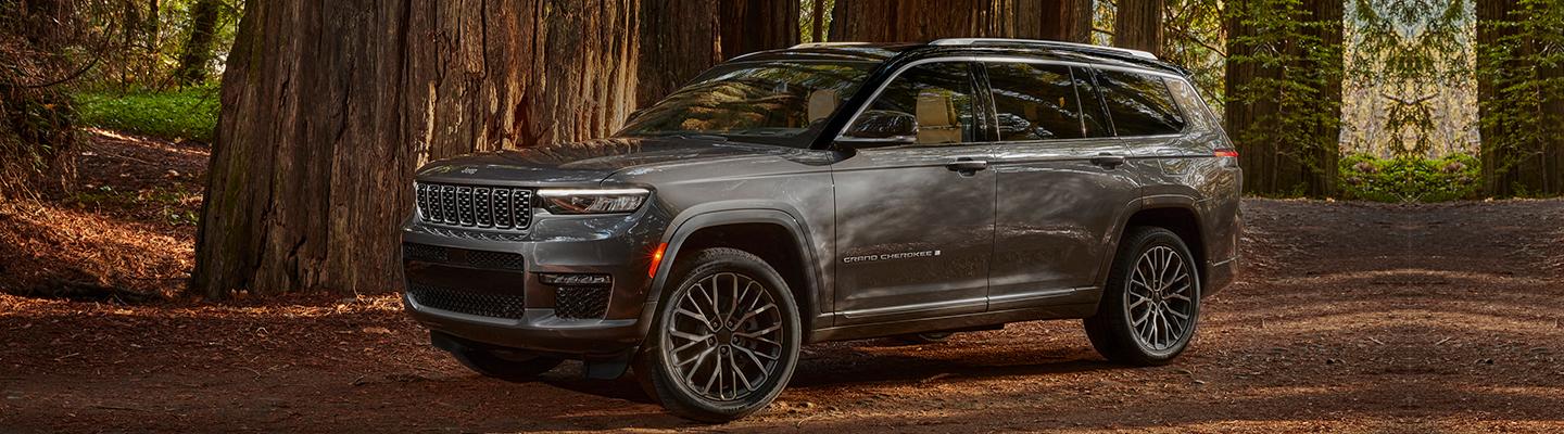 A 2021 Jeep Grand Cherokee L parked in the woods