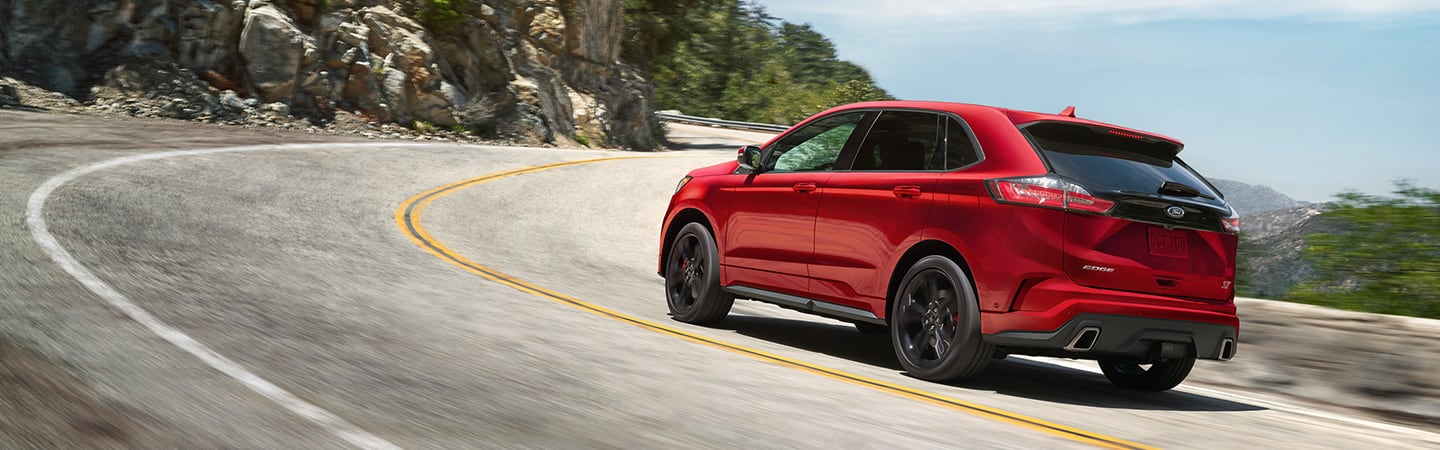 Rear view of the 2020 Ford Edge in motion