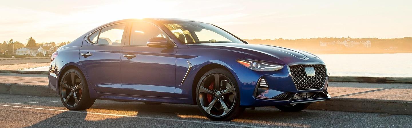 Blue G70 in motion next to water