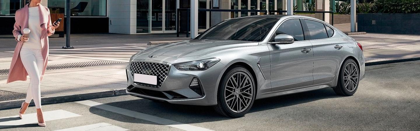 Silver G70 parked in the city