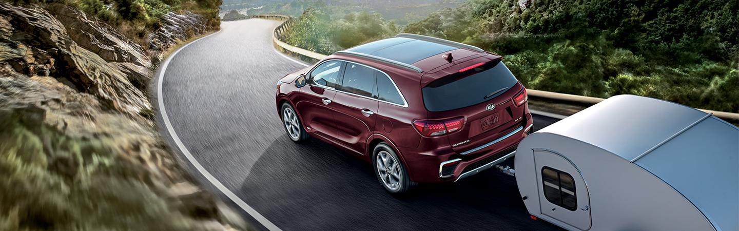 Red Sorento towing an RV