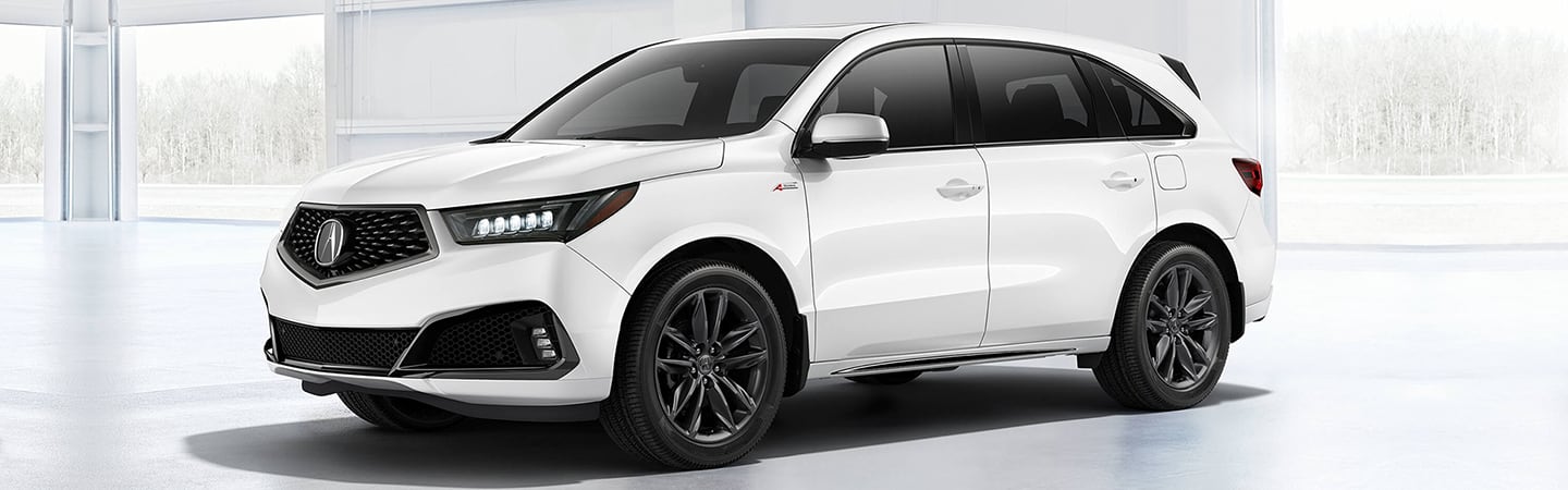 White MDX parked in a white room