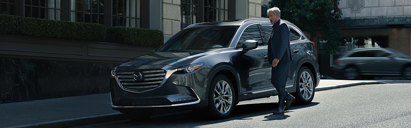 Front side view of the 2020 Mazda CX-9 parked on the side of the street