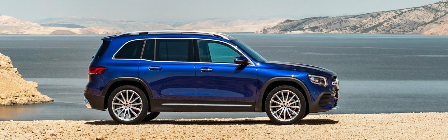 Blue Mercedes-Benz GLB near a lake
