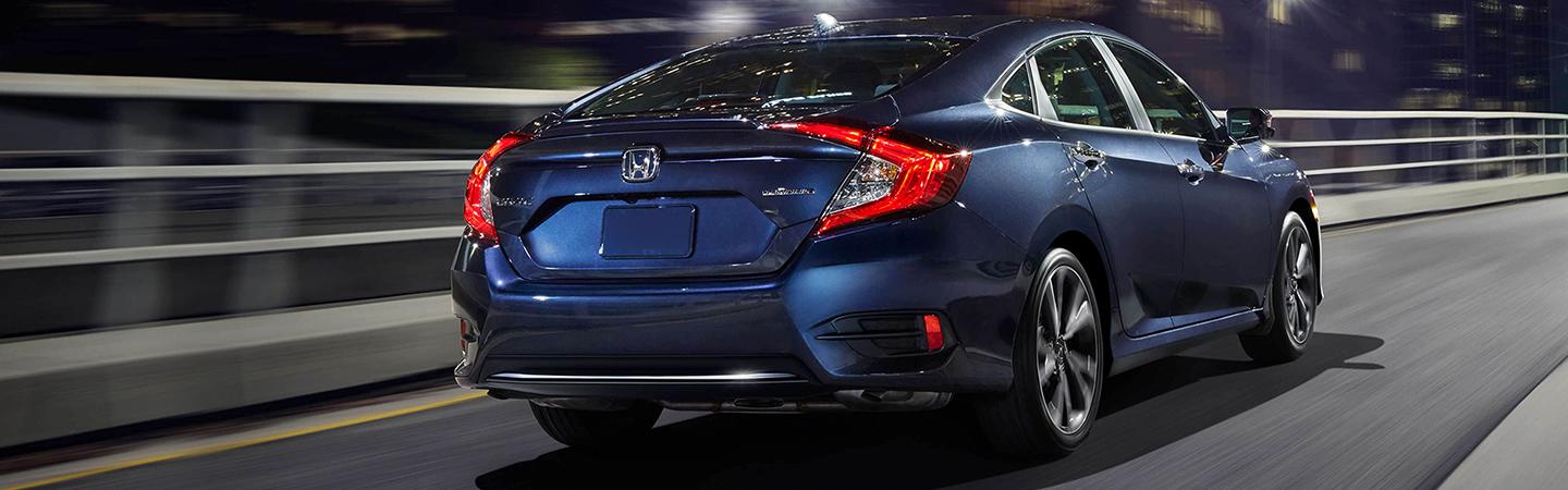 Rear view of blue Civic fin motion