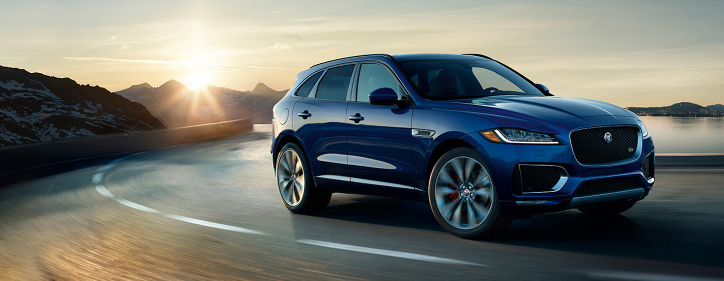 2019 Jaguar F-PACE passenger front view on turn in motion.