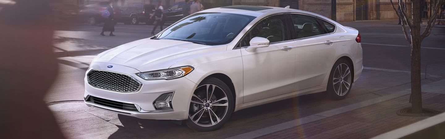 Side view of the 2020 Ford Fusion parallel parked in the city
