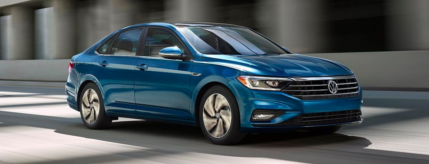 Blue 2020 Jetta in motion