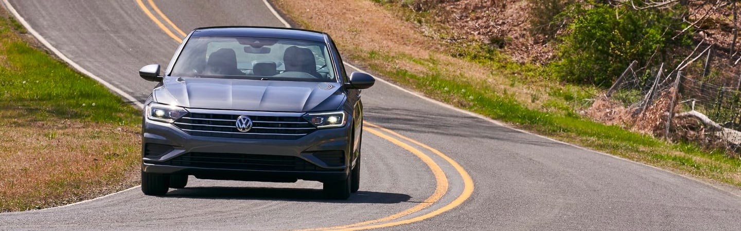 Gray Jetta in motion 