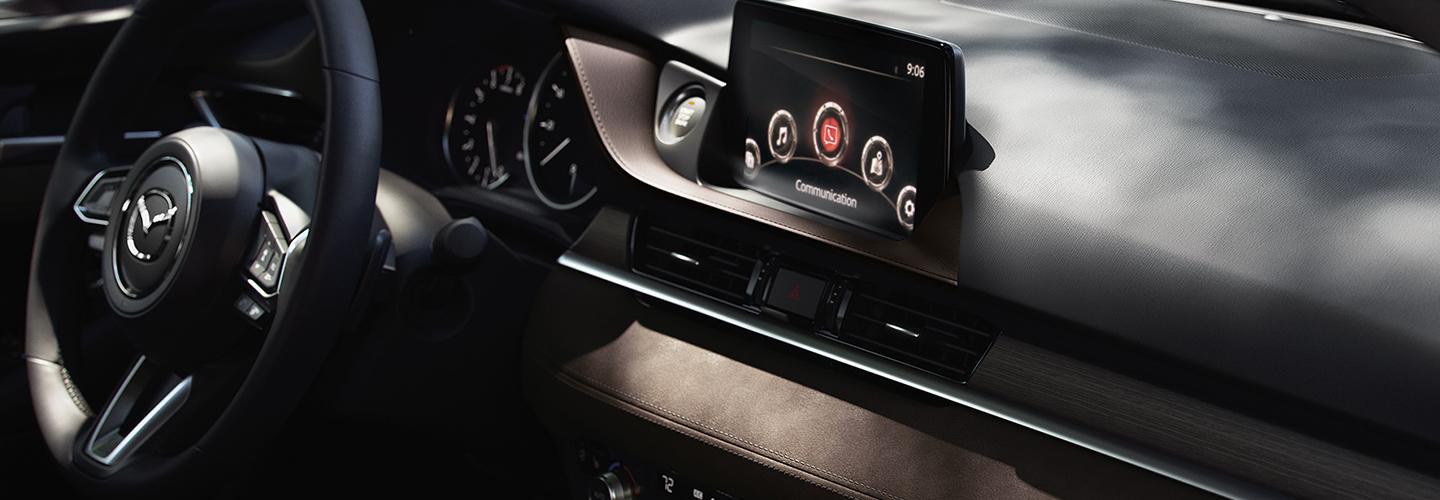 Close up of the navigation and steering wheel of the 2020 Mazda6