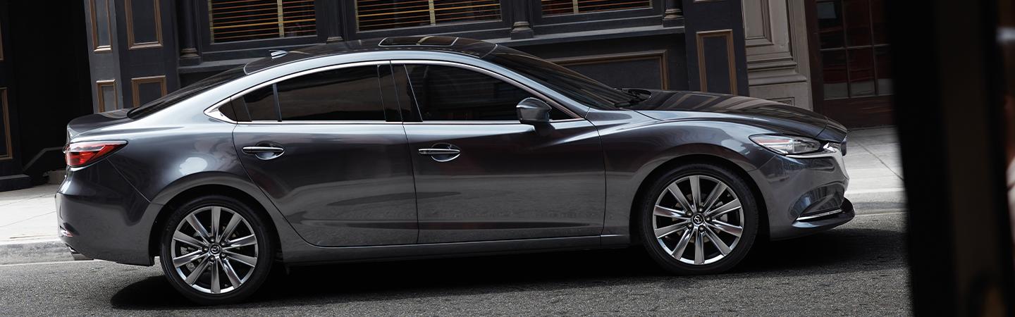 Side view of the 2020 Mazda6 parked next to a side-walk