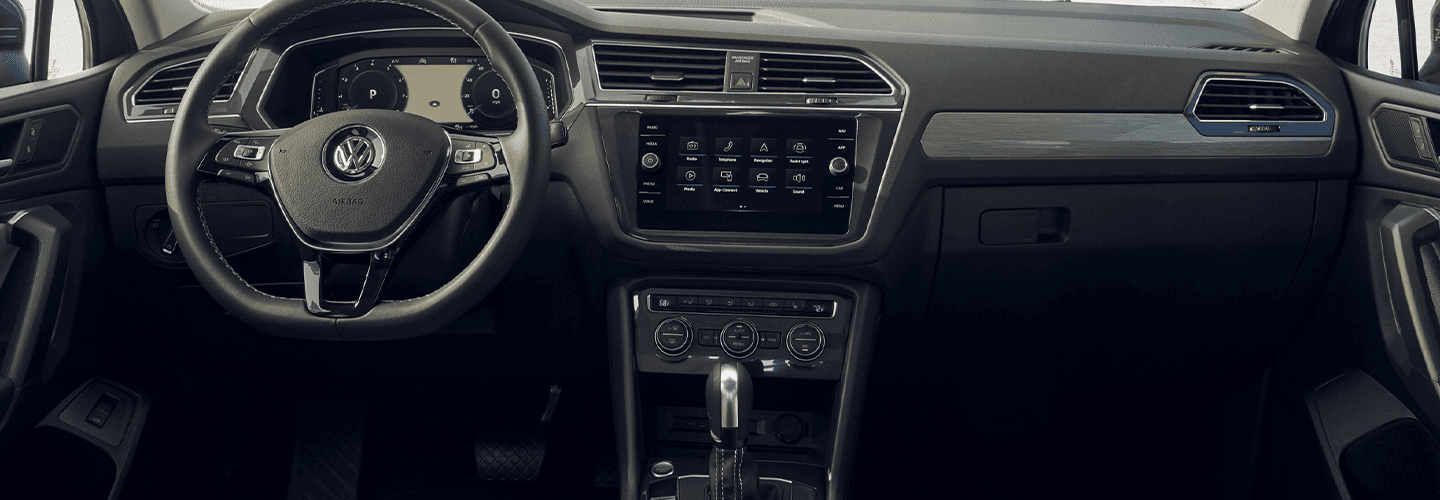 View of the steering wheel and infotainment system of the Volkswagen Tiguan.