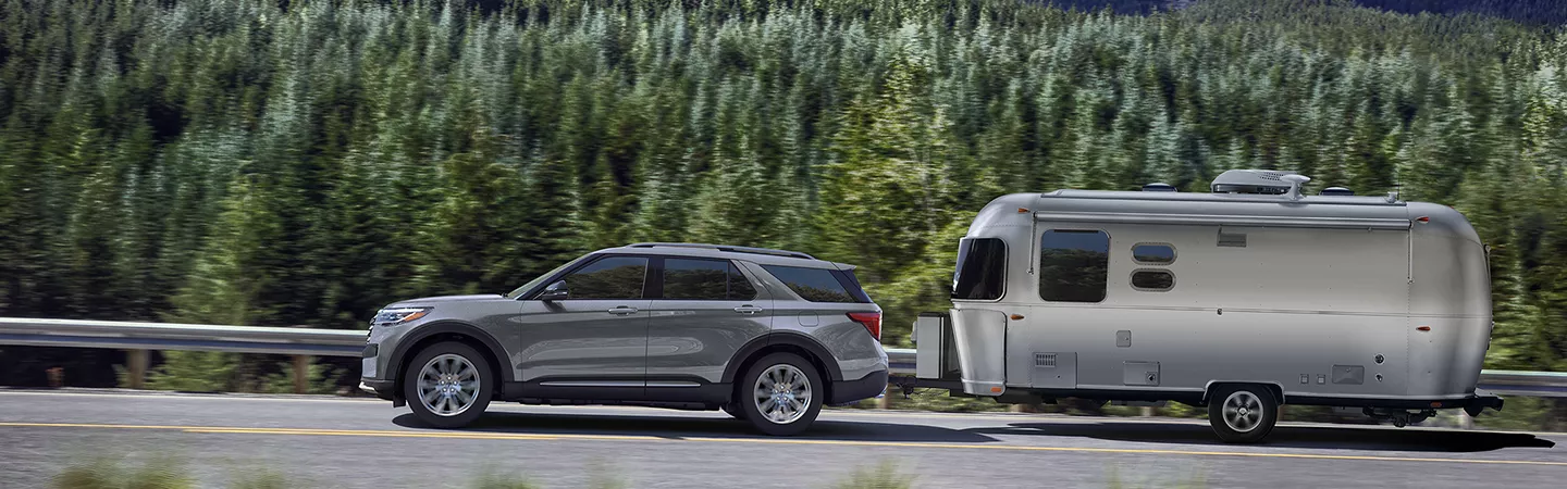 2026 Ford Explorer driving through a forest