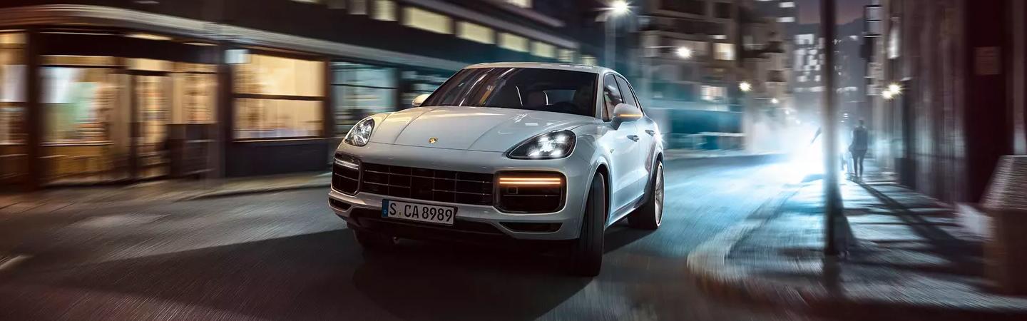 Front view of a Porsche parked at night