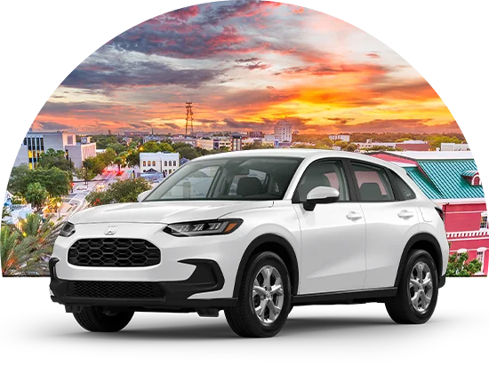 Honda HRV parked in front of cityscape