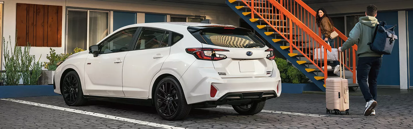 2026 Subaru Impreza parked in a parking spot, bacl view