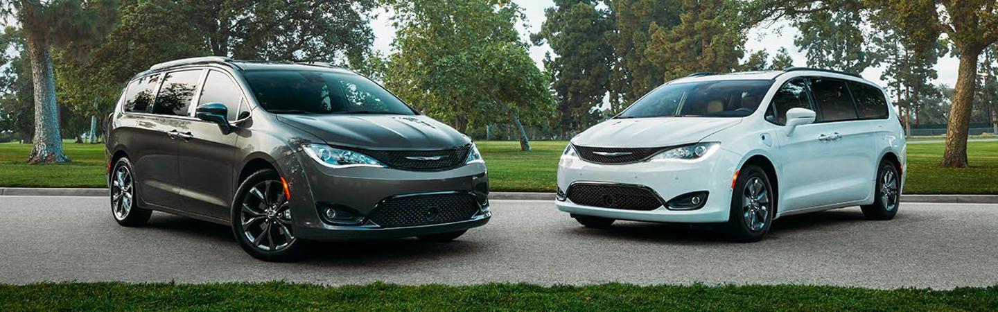 Gray and white Pacificas parked next to each other