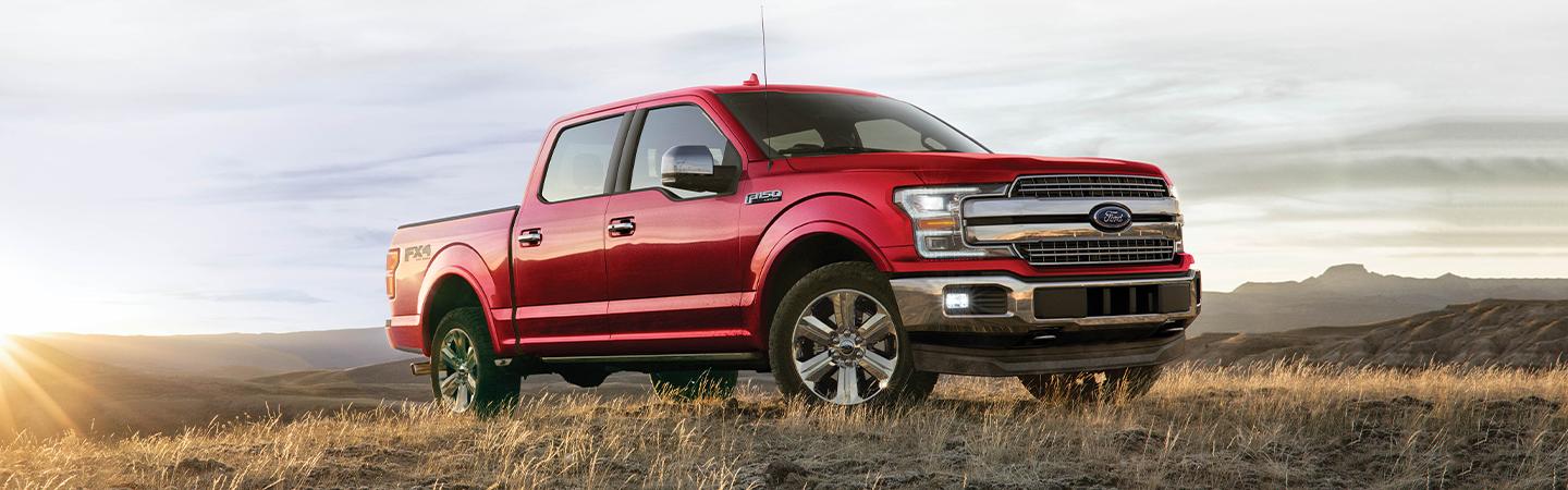 A red F-150 on top of a hill
