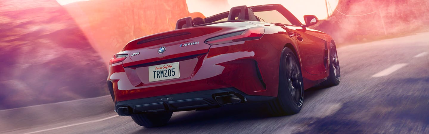 Rear view of a red 2020 BMW Z4 in motion