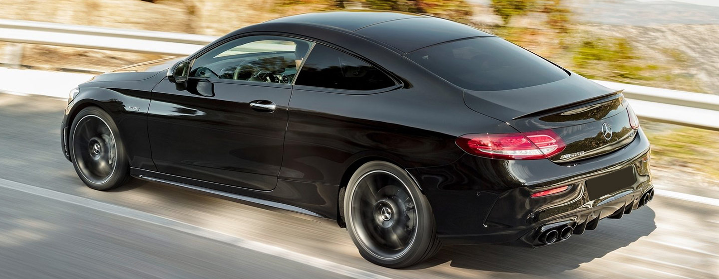 Mercedes C300 Sedan rear view driving