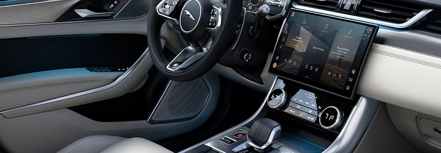 Passenger’s side view of a Jaguar XF’s dashboard and interior