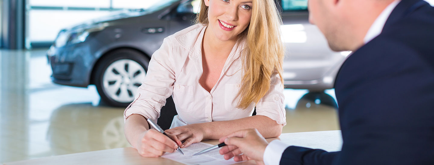 woman signing papers