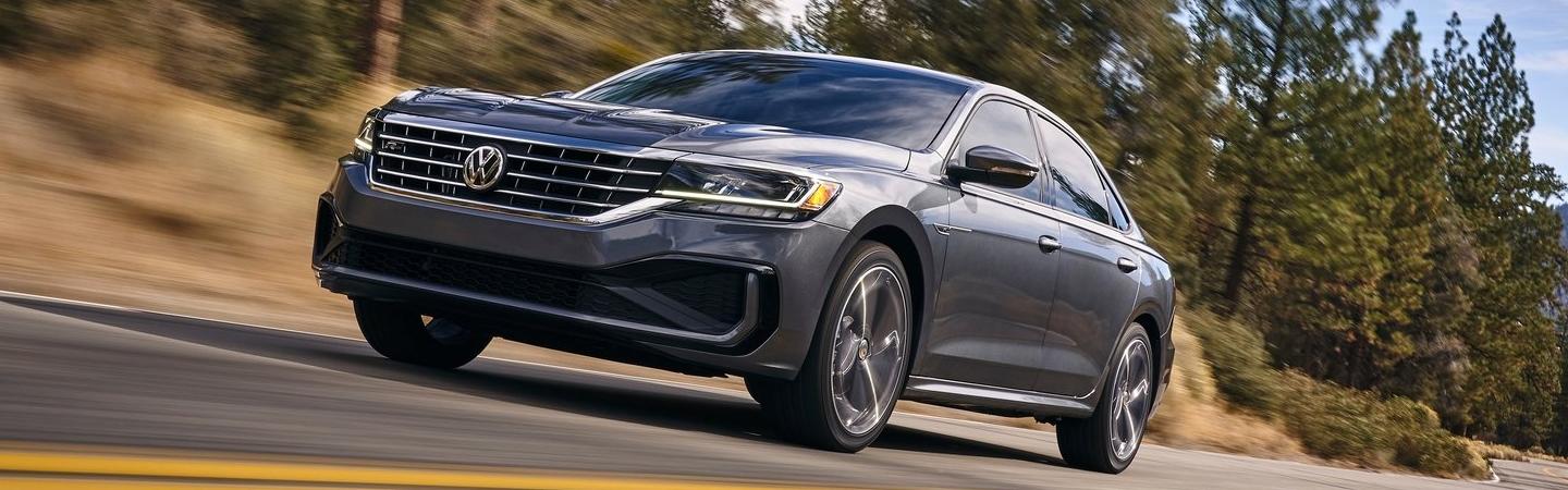 Gray Volkswagen Passat in motion