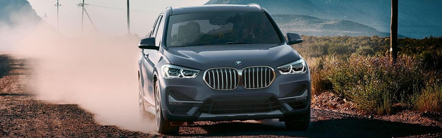 2020 BMW X1 driving on a dirt road