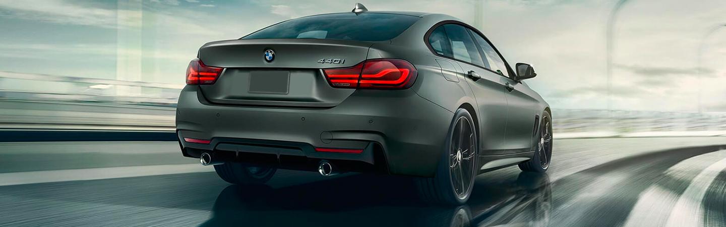 Rear view of the 2021 BMW 4 Series Gran Coupe driving on the highway