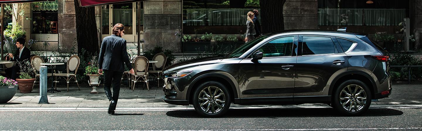 Side view of a 2020 Mazda vehicle parked