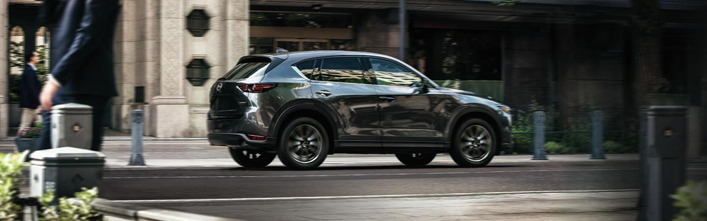 Rear view of a 2020 Mazda CX-5 in motion
