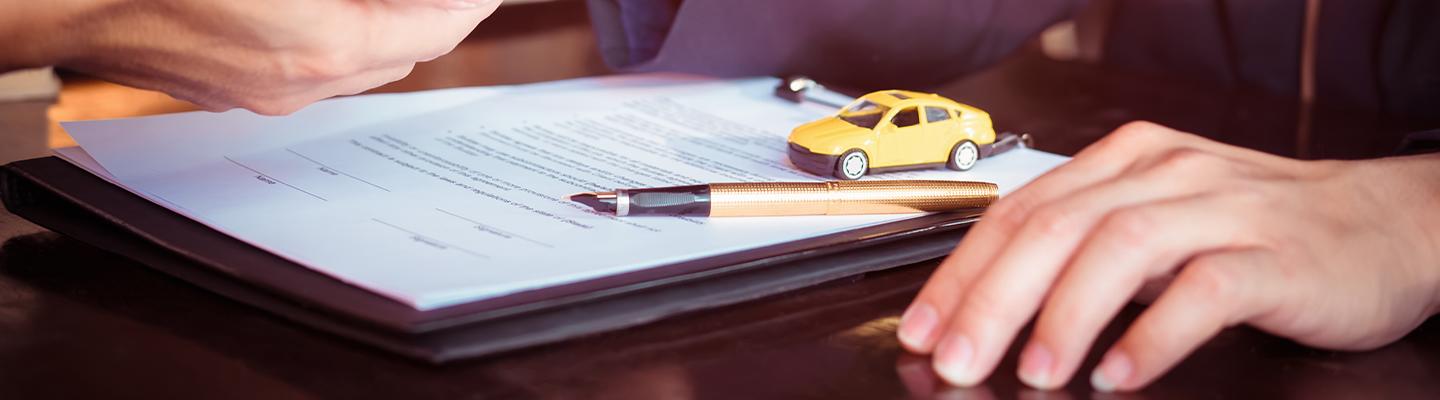 Dealership paperwork to be signed.