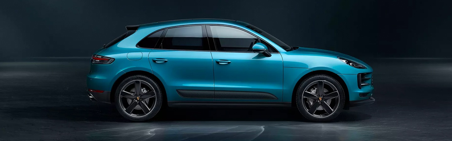 Passenger side profile of blue Porsche Macan