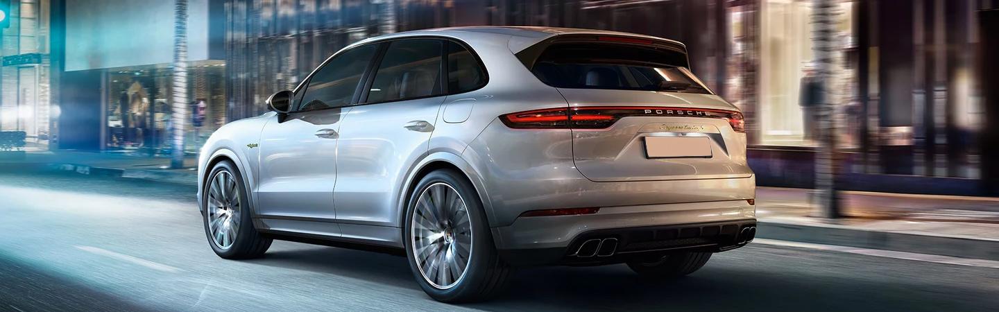 Rear view of Cayenne driving in a city