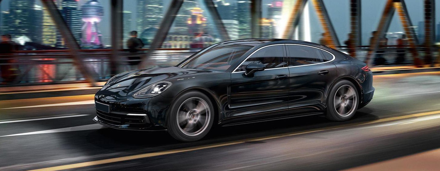 2019 Porsche Panamera crossing a bridge.