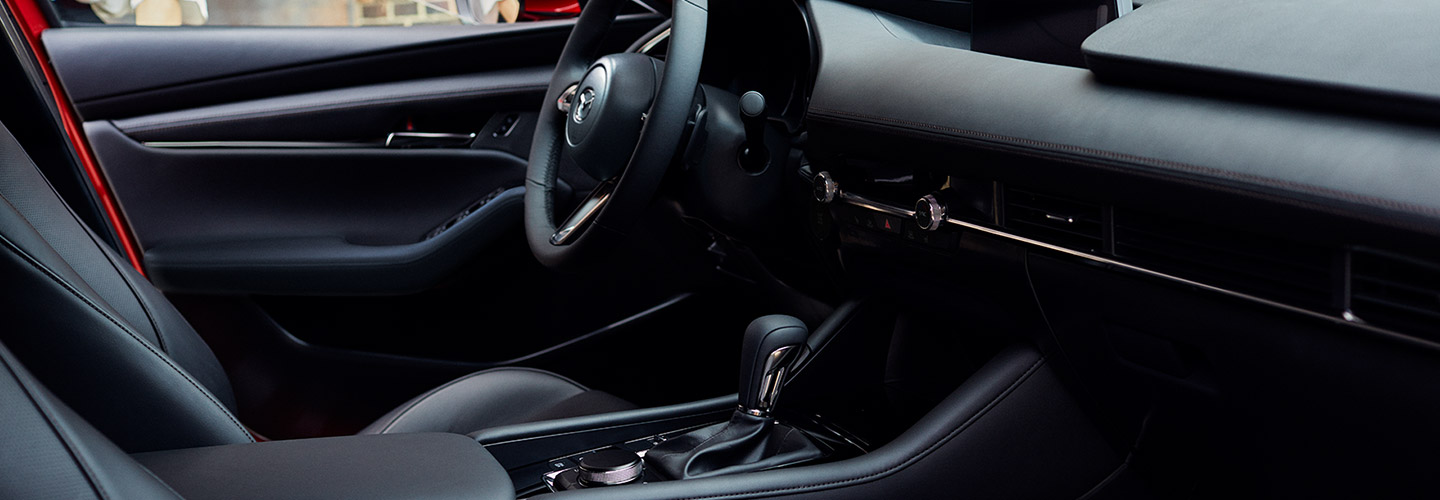 Interior and steering wheel of the 2019 Mazda3, available at our Mazda dealership.