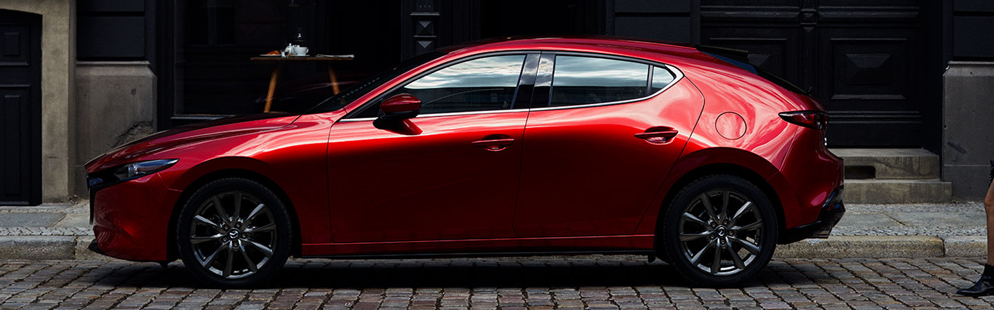 Side profile of the 2019 Mazda3 parked in Manchester, NH