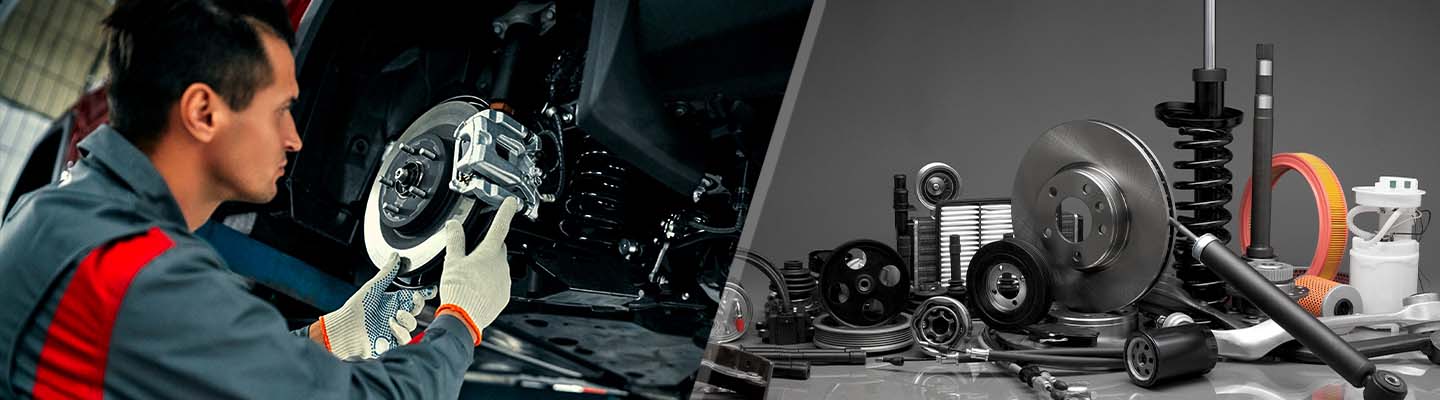 A service tech working on a Cadillac repair