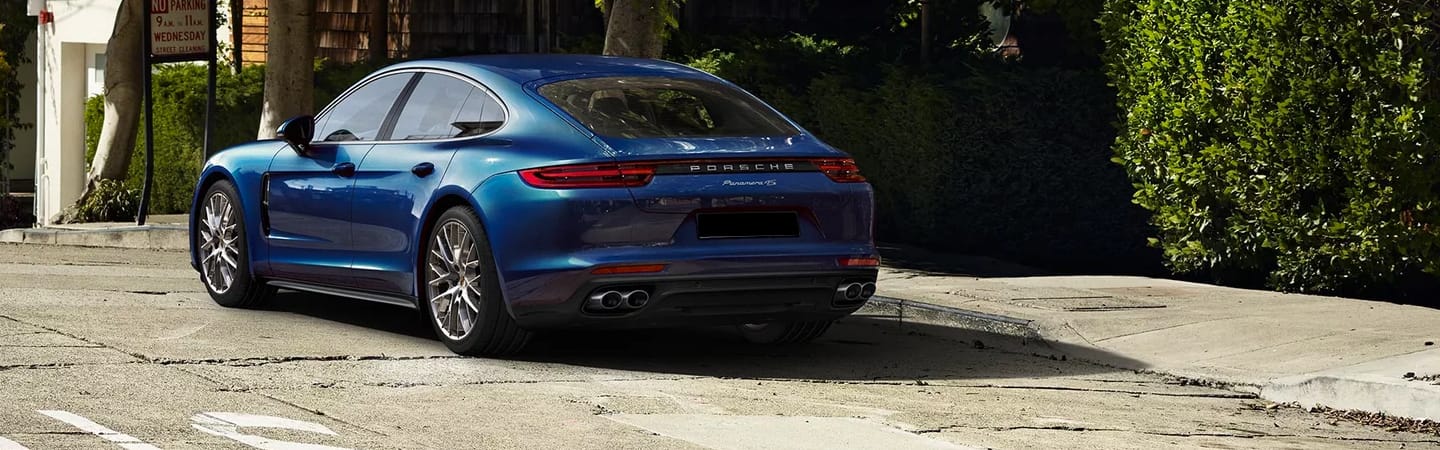 Rear view of blue Panamera parked

