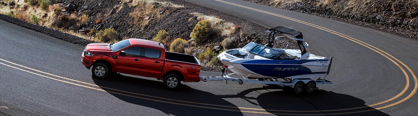 2021 Ford Ranger in motion towing a boat 