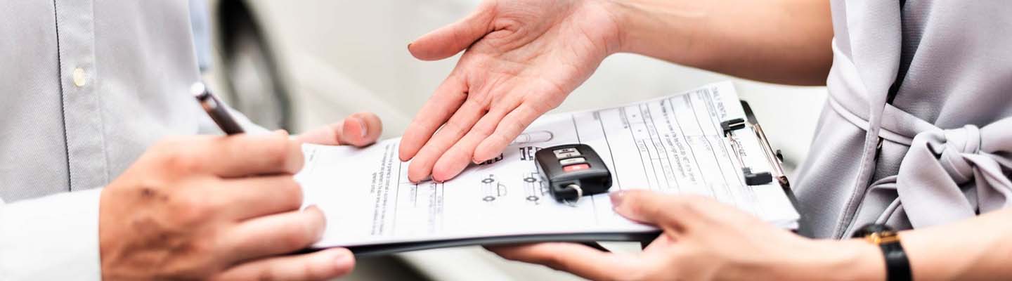 A sales professional working with a client on a new lease deal