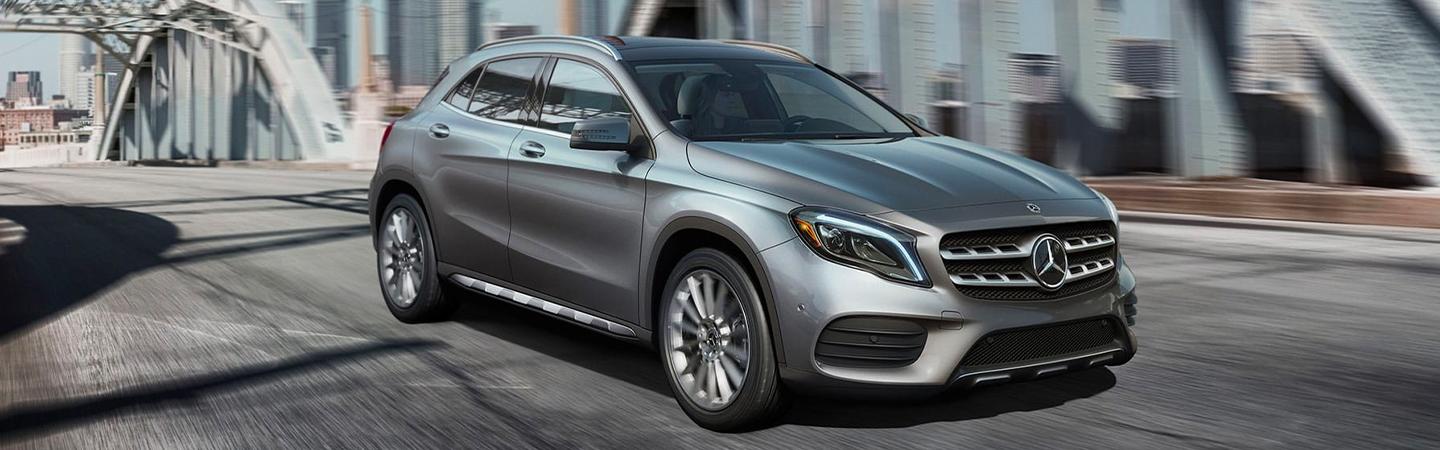 Silver GLA 250 driving on a bridge