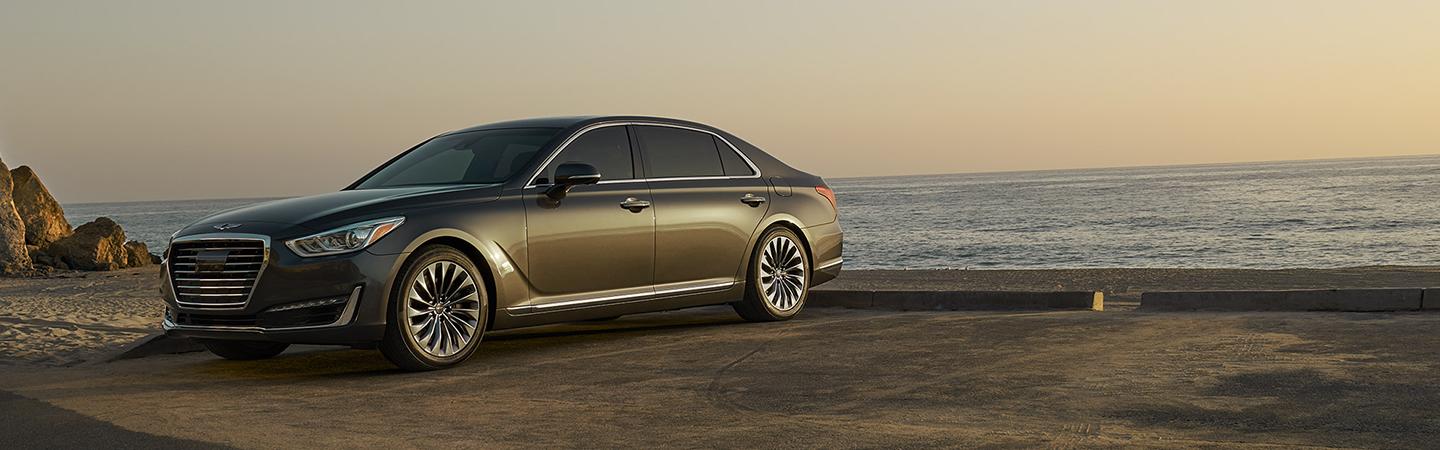 Silver G90 parked by the ocean