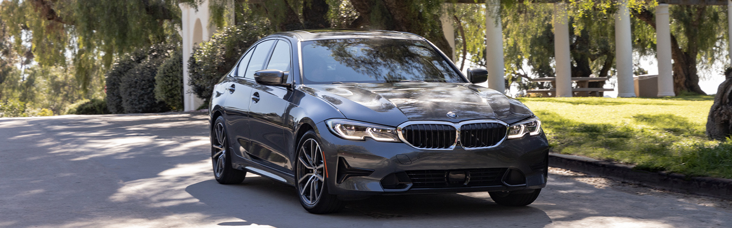 Front view of a 2021 BMW 3 Series parked in the driveway 