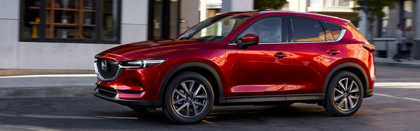 Side view of the 2019 Mazda CX-5 parked on the side of the street