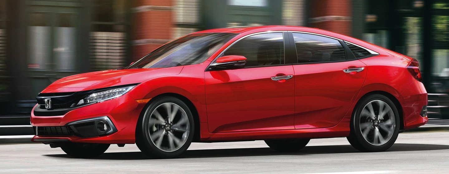 2019 Honda Civic in motion driver side view.