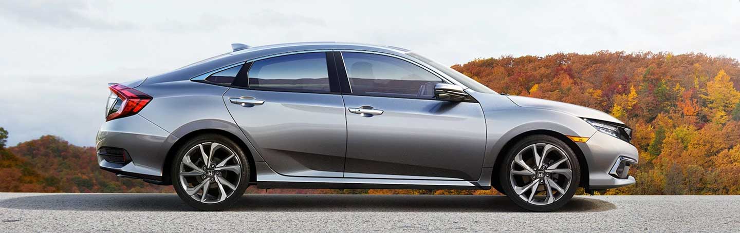 Side profile of silver Honda Civic parked